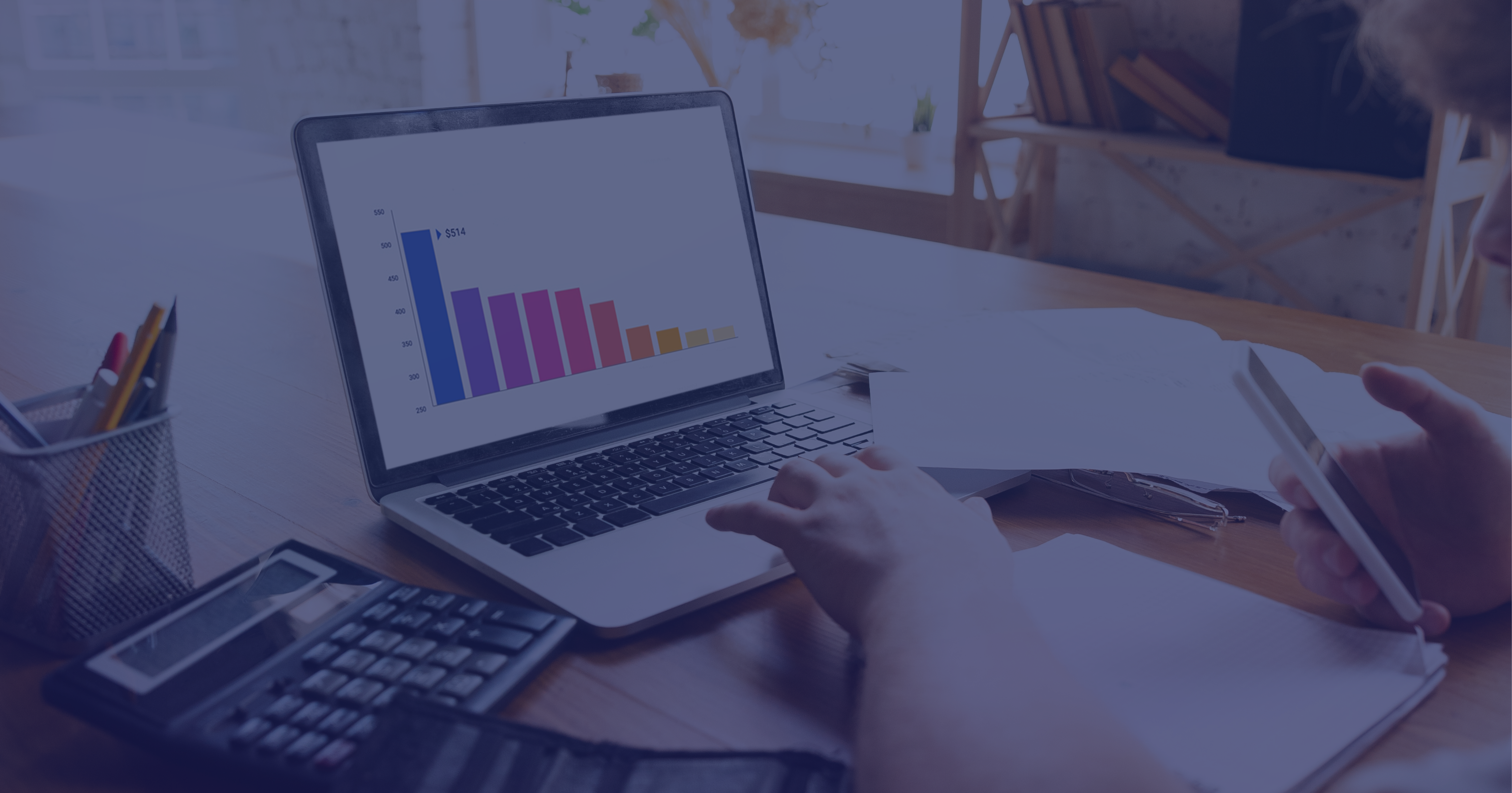 Business analytics workspace with laptop displaying bar chart data visualization, overlaid with purple filter