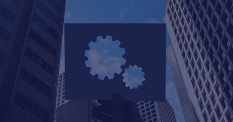 Urban skyscrapers with gear icons symbolizing DevOps integration in corporate environments