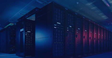 Modern data center interior with server racks illuminated by blue and red lighting in dark environment