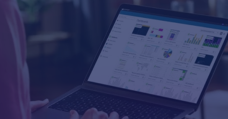 Laptop showcasing the Amazon Quick Suite interface, representing cloud-based productivity and collaboration tools on a purple-blue background.