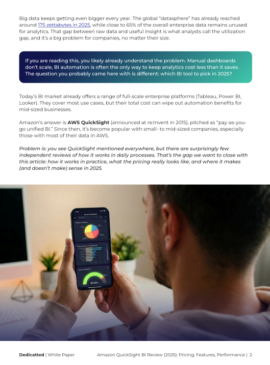 Person reviewing business intelligence dashboards on a smartphone at a desk, illustrating analytics usage and the challenge of scaling BI automation discussed in the Amazon QuickSight white paper.